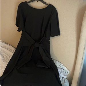Black crêpe tie waist flair dress.
